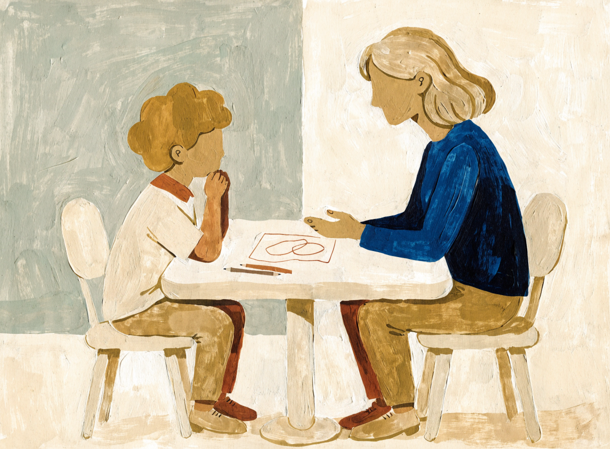 A mother listening while her child draws at a table